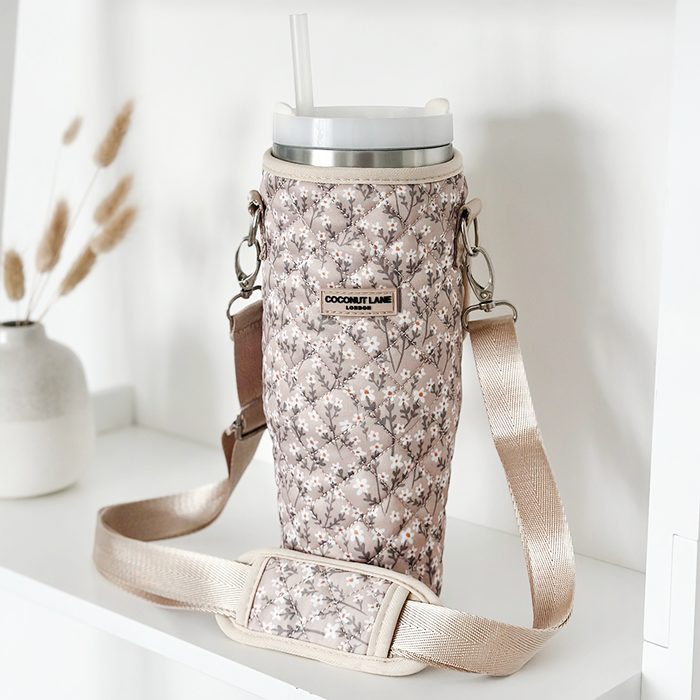 Gepolsterte Tumbler-Hülle im Nude Flowers Design – Diese stylische Tasche mit floralen Mustern schützt deinen Tumbler und verleiht ihm einen eleganten Look.