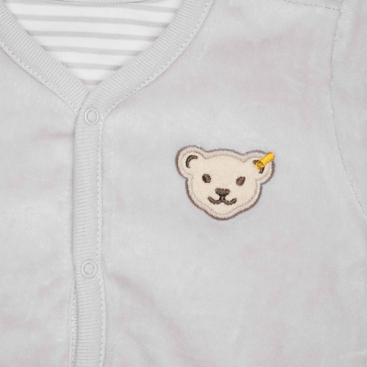 Vielseitige Steiff Wendejacke für Babys – GOTS-zertifiziert, aus weicher Bio-Baumwolle, bietet Komfort und Stil für jedes Wetter.