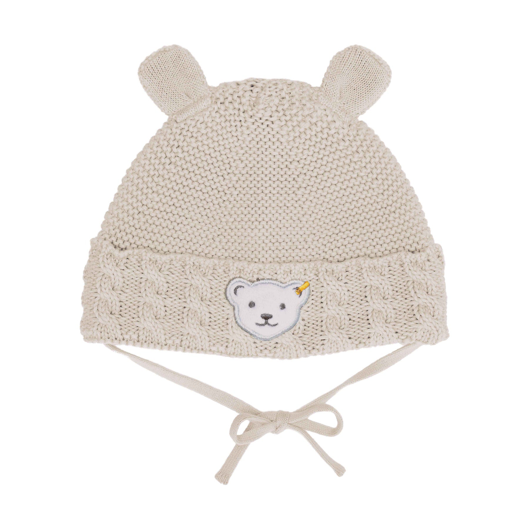 Weiche Steiff Baby-Mütze in Beige (Wind Chime) mit niedlichem Bärenmotiv und Knoten-Design.